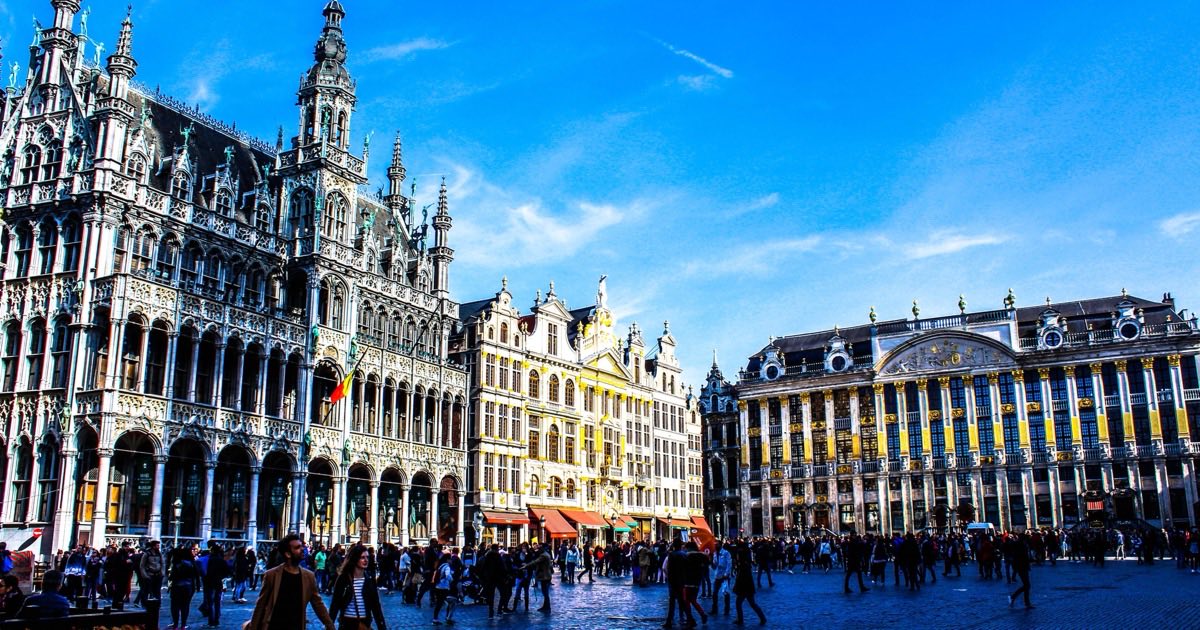Grand-Place in Brussels, with the ornate Town Hall and guildhalls beneath a blue sky